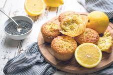 stockphotohomemadelemonpoppyseedmuffinsonlightrusticbackground623490266.jpg