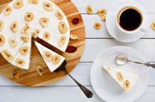 stockphotodeliciousbananacakewithcoffeecupontabletopviewslicedfruitbiscuitwithcarameland759869041-12-03-2020.jpg