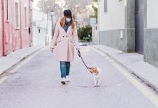 stockphotocaucasianwomaninthestreetwearingprotectivemaskandwalkingwithherdogcoronavirusconcept1670675392.jpg