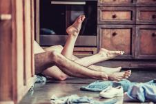 stockphotopassionateloveviewoffeetofayoungcouplethatlyingonthefloorinthekitchenathome639794776.jpg