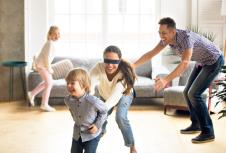 stockphotoblindfoldedmothercatchinglittlesonplayinghideandseekathomehappychildrenhavingfun1084354853.jpg