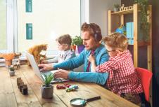 stockphotoworkfromhomemanworksonlaptopwithchildrenplayingaroundfamilytogetherwithpetcaton1681318753.jpg