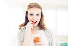 stockphotowomaneatingdriedfruit174199757.jpg