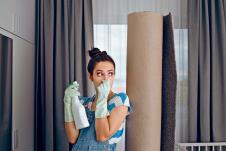 stockphotowomannexttoastinkycarpetcoveringhernosegirlhavingproblemstakingthesmelloutofan1868689477-11-03-2021.jpg