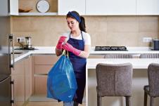 glavna-stockphotohousewifewearingprotectiverubberglovesholdinggarbagebagstandinginakitchencleaning1820879801.jpg