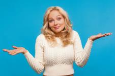 glavna-stockphotoidontknowpuzzledblondwomaninwhitesweatershruggingshouldersconfusedanduncertainwith1806795343.jpg