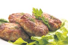 stockphotofriedmeatballswithherbsonwhitebackground166718567.jpg