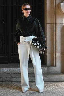 stockphotoparisfrancefebruarystreetstyleoutfitwomanwearingblackleathershirtwhite1344603632.jpg