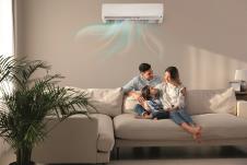 stockklima-uredjaj-photohappyfamilyrestingunderairconditioneronbeigewallathome2159582495.jpg