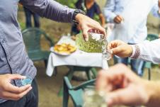 1005-stockphotocloseuponmidsectionofmalehandsholdingdrinkingglassespouringhomemadedomesticbrandy1453153196.jpg