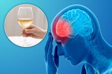slikovit prikaz čoveka koji se drži za glavu a vidi mu se mozak i upala na jednom delu/čaša belog vina