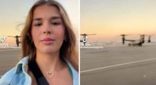 Kai Tramp snima video na aerodromskoj pisti dok se u pozadini vide vojne letelice