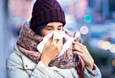 stockphotoprettyyoungwomanblowinghernosewithatissueoutdoorinwinteryoungwomangettingsickwith715823824.jpg