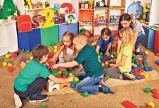 stockphotochildrenbuildingblocksinkindergartengroupkidsplayingtoyonfloortopviewofinterior722685523.jpg