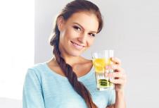 stockphotohealthylifestylefoodhappywomandrinkingsummerrefreshingfruitflavoredinfusedwaterwith338406827.jpg