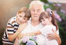 stockphotocloseupsummerportraitofhappygrandmotherwithgrandchildrenoutdoors377530423.jpg
