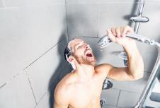 stockphotoamaninshowerwashinghishairwithshampoo591344225.jpg