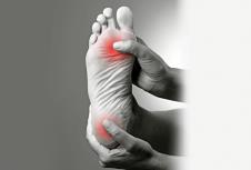 stockphotopaininthefootmassageoffemalefeetacheinthehumanbodyonagraybackgroundblackand367043777.jpg