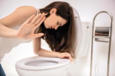 stockphotoyoungwomanvomitingintothetoiletbowlintheearlystagesofpregnancyorafteranightof306461963.jpg