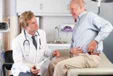 stockphotodoctorexaminingmalepatientwithhippain126687932.jpg