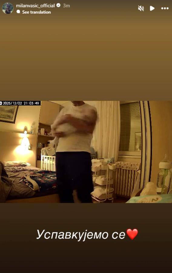 Milan Vasić uspavljuje sina .jpg