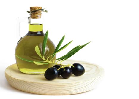 stockphotofreshorganicoliveoilwitholivesonawoodenboardisolatedonawhitebackground540612532.jpg