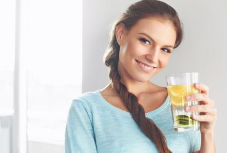 stockphotohealthylifestylefoodhappywomandrinkingsummerrefreshingfruitflavoredinfusedwaterwith338406827.jpg