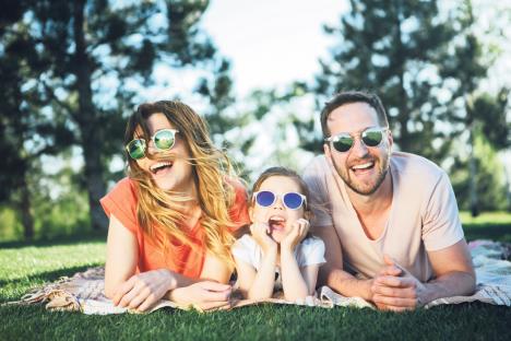 stockphotohappyfamilyresttogetherinopenair1082046296.jpg