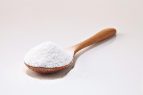 stockphotowoodenspoonfullofbakingsodaonthewhitebackground465765608.jpg