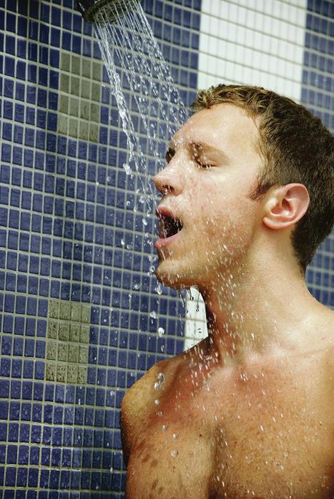 stockphotoportraitofhandsomeblondmanunderanoutdoorshower81072178.jpg