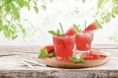 stockphotosummercolddrinkwithwatermelonmintandlemononawoodenbackground682256089.jpg