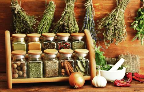 stockphotodriedherbsspicesandandpepperonwoodenbackground110359328.jpg