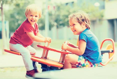 stockphototwohappylittlegirlsonteeteringboardoutdoor537718882.jpg