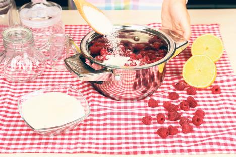 stockphotowomancookingraspberryjaminkitchen219191728.jpg