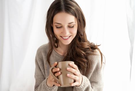 stockphotobeautifulwomanenjoyingcoffeeinthemorningsittingbythewindow250532551.jpg