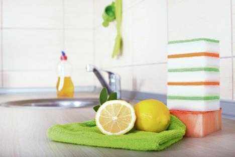 stockphotodishwashingconceptcloseupoflemonandspongesfordishwashingonthekitchencountertop375194614.jpg