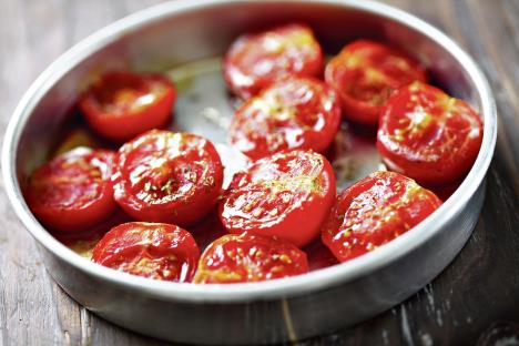 stockphotobakingtraywithcherrytomatoesdrizzledwithsaltoliveoilandoregano131209031.jpg