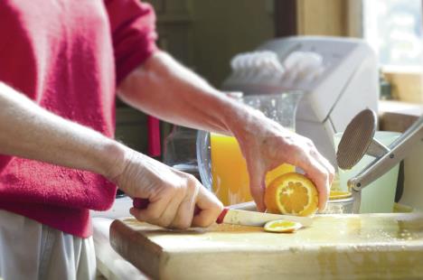 stockphotoanoldwomanshandspeelcitrusfruittomakefreshorangejuiceconceptphotoofmaturewoman100403167.jpg