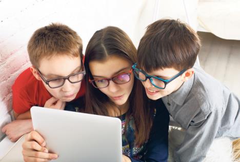 stockphotogroupofkidsineyeglasseslookintotabletchildrencomputergamessocialnetworksandmedia413903803.jpg