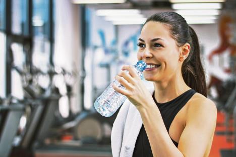 stockphotoprofileofbeautifulwomangoingtodrinksomewaterfromplasticbottleafterworkout564953092.jpg