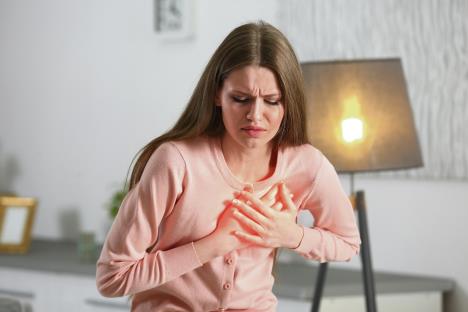 stockphotoheartattackconceptwomansufferingfromchestpainindoor649269130.jpg