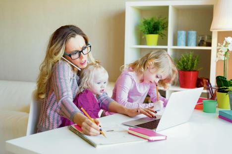 stockphotobusywomantryingtoworkwhilebabysittingtwokids1070125520.jpg