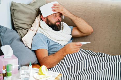 stockphotohightemperatureconceptmanfeelsbadlyillhowtobringfeverdowncoldsymptomsandcauses1483258463.jpg