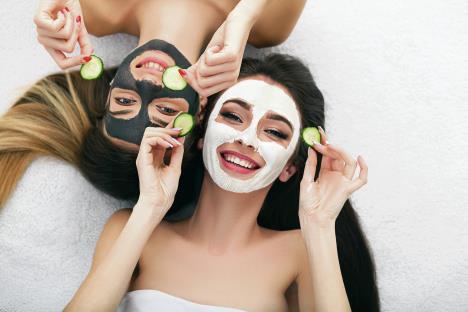 stockphotoapictureoftwogirlsfriendsrelaxingwithfacialmasksonoverwhitebackground1009330039.jpg