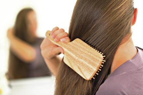 stockphotocloseuponyoungwomancombinghair188544620.jpg