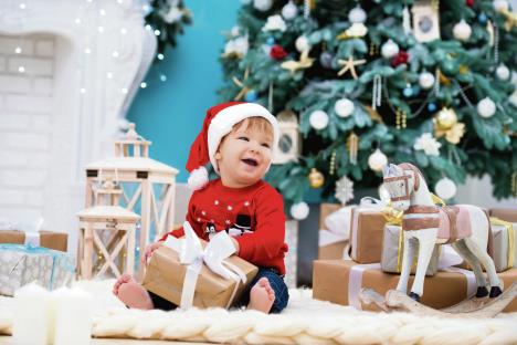 stockphotolittlebabysantaclausinchristmashathappynewyearandmerrychristmasholidaysandgifts1339700294.jpg