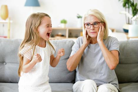 stockphotoshockedgrandmaclosingearsnottohearnoisystubbornfussylittlegranddaughterscreaming1231591498.jpg