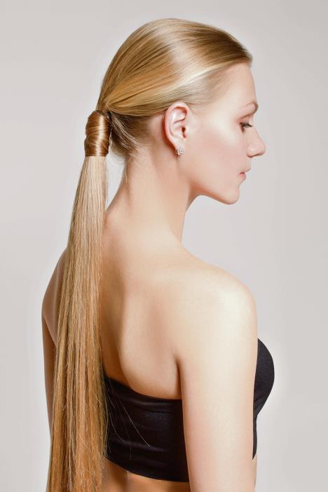 stockphotowomanwithahairtailcleanskinofthefaceblondegraybackground1317462881.jpg