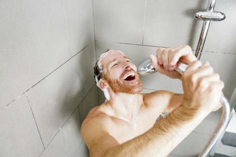 stockphotoamaninshowerwashinghishairwithshampoo591344165.jpg