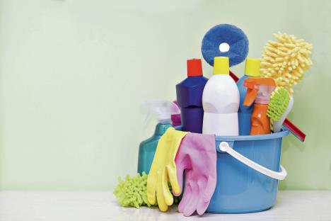 stockphotohousecleaningproductonwoodtablewithgreenbackground528059266.jpg